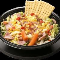 Chef Salad · Lettuce, Diced Ham, Cheddar Cheese, Bacon, Diced Tomatoes, Diced Eggs with a side of Carrots...