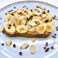 Banana Crunch · Organic Peanut Butter Spread With Sliced Organic Bananas, Organic Chocolate Hazelnut Drizzle...