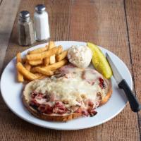 Reuben Burger · Served with grilled corned beef, sauerkraut, Russian dressing, and Swiss cheese.