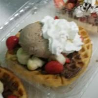 Waffles ‘N” Binges · Freshly made Belgian waffle topped with Nutella, ice cream , banana, strawberries, nuts and ...