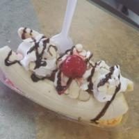 Banana Split · 3 Flavor small scoops, Hershey chocolate, wafer, whip cream and cherry.