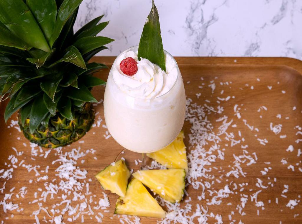  Caribbean Dream Piña Colada  · Blended frozen drink with Coconut and Pineapple