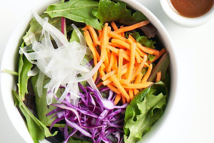 Mixed Green Salad · Organic mixed greens, carrot, onion, and red cabbage with house-made no oil dressing or creamy sesame dressing. 