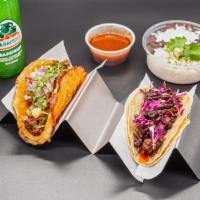 2x Taco Combo · 2 tacos, choice of lime-cilantro rice & refried beans or chips and salsa and non alcoholic d...