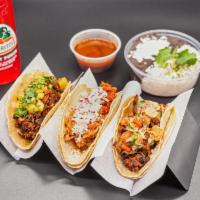 3x Taco Combo · 3 tacos, choice of lime-cilantro rice and refried beans or chips and salsa and non alcoholic...