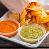 Chips & Salsa (v) · House Made Salsa Roja or Salsa Verde and Chips

