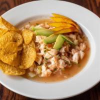 Ceviche · Freshly diced shrimp cooked in lime juice with cucumbers, tomatoes, onions, cilantro and/or ...
