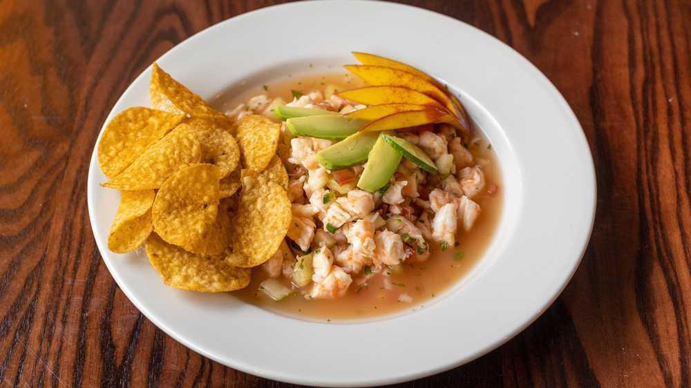 Ceviche · Freshly diced shrimp cooked in lime juice with cucumbers, tomatoes, onions, cilantro and/or mango or avocado.