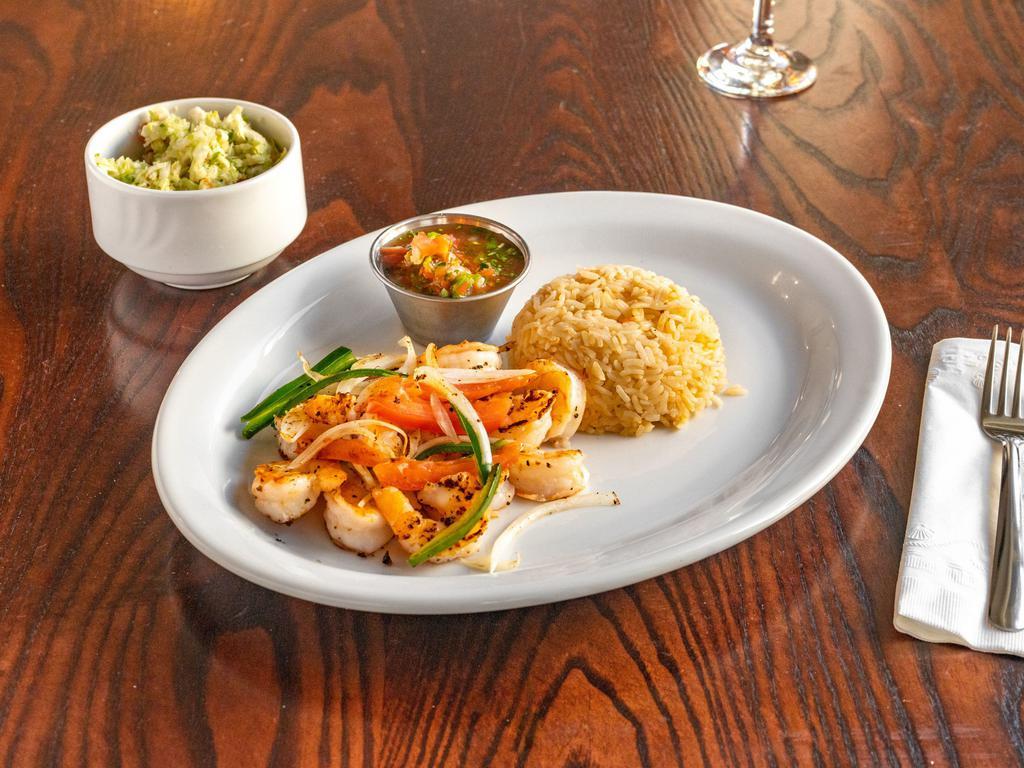 Grilled Shrimp · Seasoned with a bit of spice, these shrimp are grilled to perfection, topped with grilled onions, bell peppers & tomatoes, served with side of Spanish rice and citrus cabbage salad.