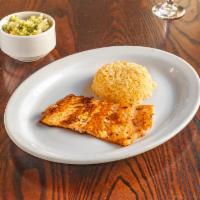 Salmon · Grilled Salmon filet served with side of Spanish rice and a citrus cabbage salad. 