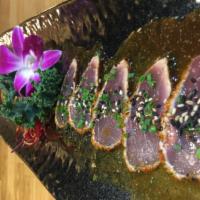 Tataki · Thin slices with Japanese chili powder and yuzu soy sauce.
