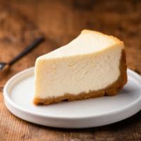 The Cheesecake · A rich and creamy New York style cheesecake baked inside a honey Graham crust.