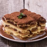 Tiramisu Big Ladyfinger · Layers of espresso dreched ladyfingers seperated by mascarpone cream and dusted with cocoa p...