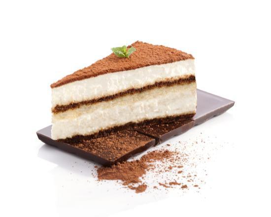 Tiramisu · Sponge cake soaked in espresso, topped with mascarpone cream and dusted with cocoa powder delivered in a glass bowl.