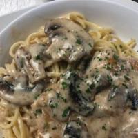 Monas Creamy Chicken Marsala · Grilled chicken topped with creamy mushroom sauce served with a side of mash potatoes or pasta
