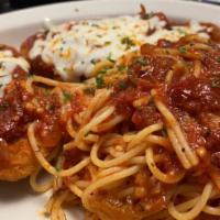 Chicken Parmigiana (Lunch) · Breaded chicken breast with melted mozzarella on top and glazes tomato sauce served with a s...