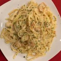 Seafood Alfredo (DINNER) · A creamy cheesy alfredo sauce with shrimp and scallops tossed in fettuccine pasta.