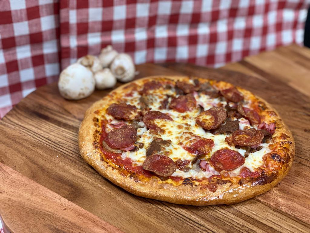 Manny's Meat Special Pizza · Served with sausage, pepperoni, ground beef, bacon, ham, and gyro meat (shaved lamb and beef).