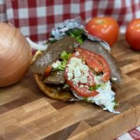 Gyro Sandwich · Tender strips of lamb and beef topped with crisp lettuce, red ripe tomatoes, onions and feta...