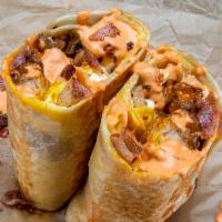 Breakfast Burrito · 3 eggs, smoked bacon, white American cheese, crispy tater tots, caramelized onions, spicy ma...