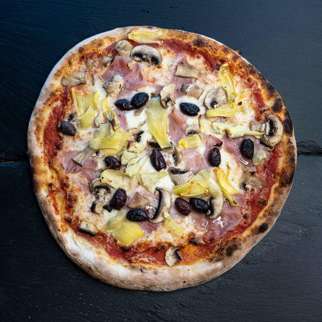Pizza Capricciosa · TOMATO SAUCE, MOZZARELLA, HAM, MUSHROOM, ARTICHOKE, BLACK
OLIVES KALAMATA