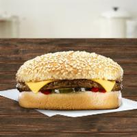 Del Cheeseburger · A 100% beef patty, American cheese slice, ketchup, and dill pickle chip on a grilled sesame ...