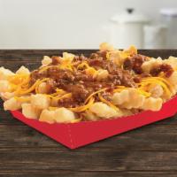 Chili Cheese Fries · Crinkle-Cut Fries topped with beefy chili and freshly hand-grated cheddar cheese.