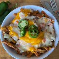 Dirty Cajun Fries · Seasoned fries tossed in our house made spice blend, covered in dirty sauce, jalapenos, and ...