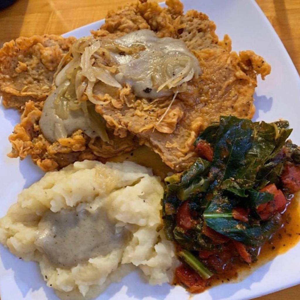 Seitan Steak Plate · House-made seitan-steaks served with our savory gravy, sauteed onions, greens and creamy mashed potatoes.