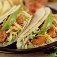 Baja-Style Shrimp Taco · Two soft corn tortilla tacos filled with grilled shrimp and crisp cabbage topped with baja s...