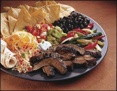 3 Pepper Fajita · Grilled chicken or sirloin steak, fire-roasted fajita veggies, guacamole, cheese and sour cream. Served with corn or flour tortilla, choice of beans and rice. 