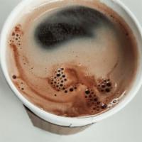 Americano · Espresso poured over hot water.