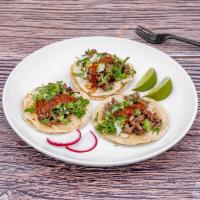 Tacos · Choice of meat, onion, cilantro, and salsa.