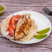 Fish Tacos · Grilled Filet fish served with tomatoes slices, cabbage and cilantro vinaigrette.