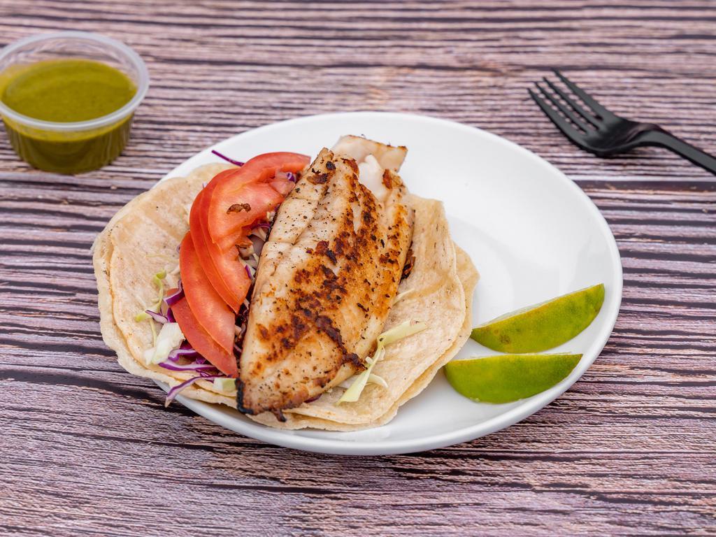 Fish Tacos · Grilled Filet fish served with tomatoes slices, cabbage and cilantro vinaigrette.