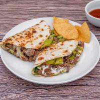 Quesadillas · Choice of meat, cheese, Lettuce, guacamole and sour cream.