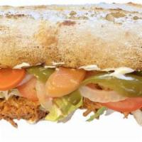 Lonche de Pierna · Marinated shredded pork sandwich with crema, lettuce, tomatoes, red onions, and jalapenos cu...