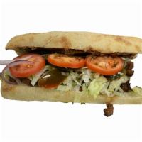 Torta · Choice of meat, refried beans, cheese, avocado lettuce, onions, jalapenos and salsa on a cia...