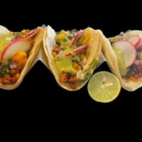 Street Tacos · Choice of meat topped with beans, salsa, red onions, cilantro, radishes, and lime. Comes wit...