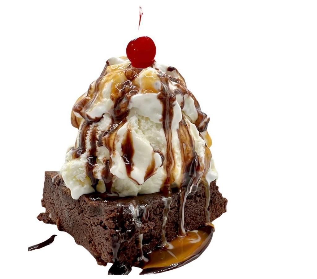 Hot Brownie Sundae · Warm fudge brownie topped with your favorite ice cream and whipped cream and drizzled with chocolate and caramel sauce.