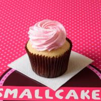 Pink Vanilla Cupcake · Vanilla cake with our signature pink buttercream frosting and topped with pink sugar sprinkl...