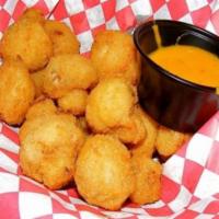 Fried Mushrooms · 12 pieces of Fresh whole button mushrooms batter-dipped in a savory coating and deep fried. 