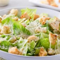 Caesar Salad · Romaine, lettuce, garlic croutons and shaved Parmesan cheese. Served with Caesar dressing.