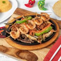 Fajitas Rice · Our yellow rice topped with melted queso and your choice of chicken or steak fajita. Not ser...