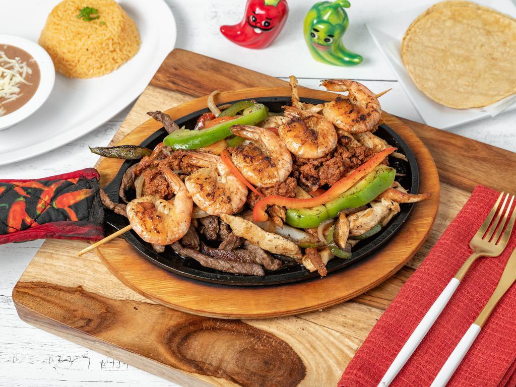 Fajitas Rice · Our yellow rice topped with melted queso and your choice of chicken or steak fajita. Not served with beans or tortillas.