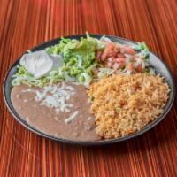 Fajitas Specialty · Sauteed bell pepper, onion, tomato and choice of protein. Served with rice, beans, lettuce, ...