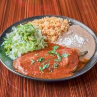Chile Relleno Specialty · Cheese-stuffed chile relleno simmered in salsa. Served with rice, refried beans, lettuce, gu...