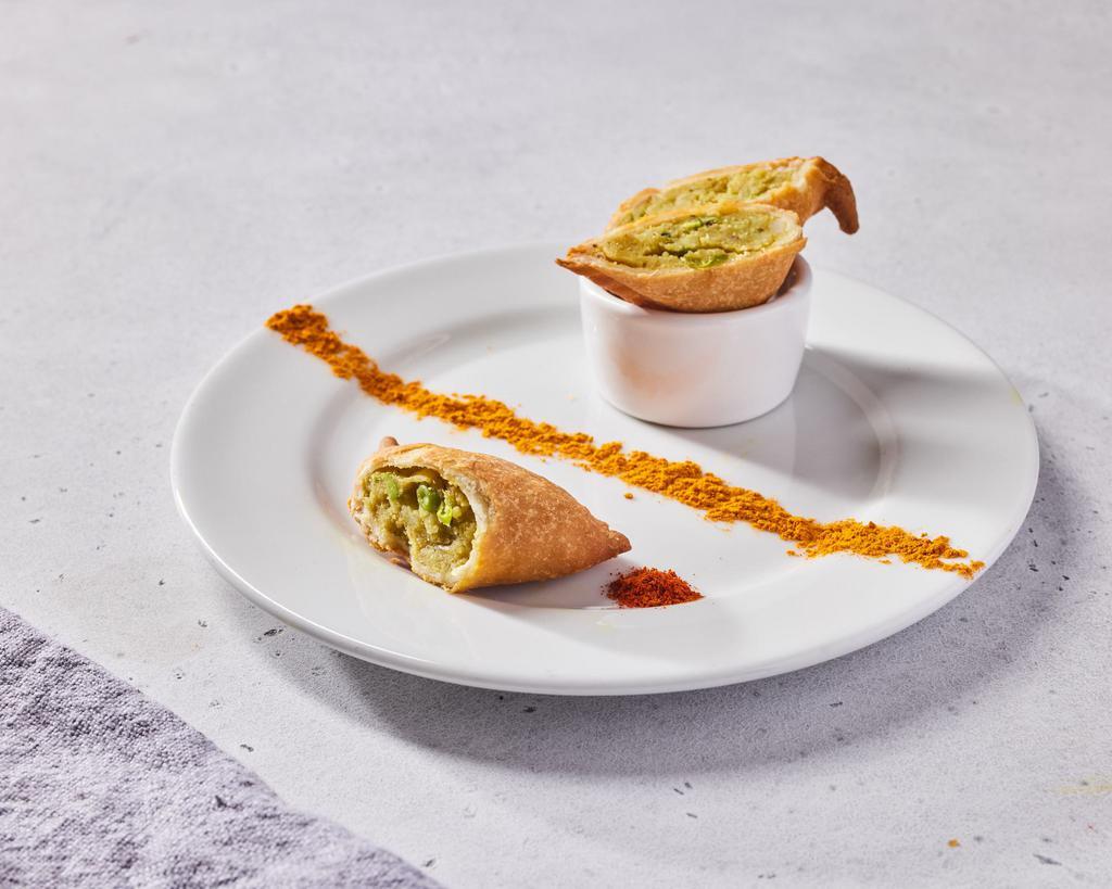 Classic Northern Samosas (VG) by dosa by DOSA · By dosa by DOSA. 2 pieces. Savory Indian pastries made with spiced potatoes, green peas, ginger, garlic, cilantro, and served with mint tamarind chutney. Contains gluten and nightshades. We cannot make substitutions.