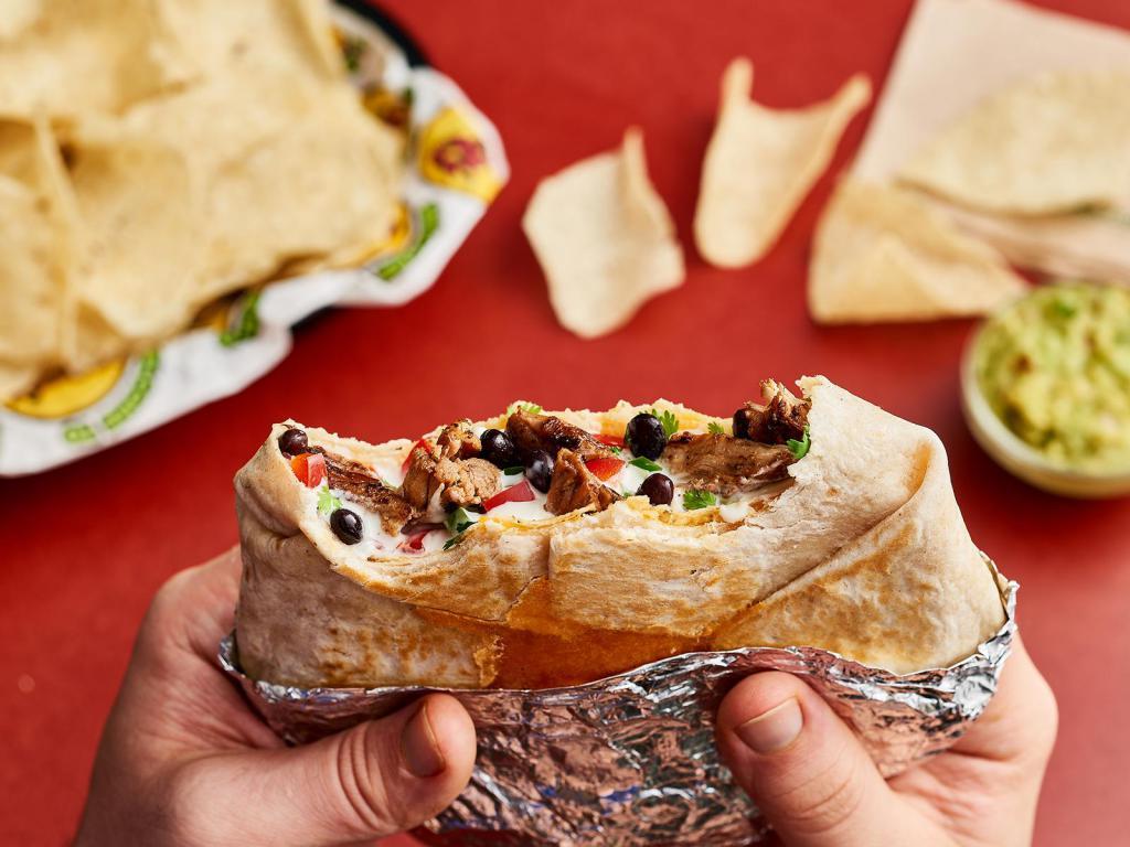 The Stacker · Your choice of beans, shredded cheese, pico de gallo and Moe's Famous Queso stacked between two crunchy corn shells wrapped in a grilled tortilla. Protein options include all-natural steak, adobo chicken, ground beef, or organic tofu.