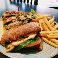 Jamaican-Me-Crazy · jerk-spiced grilled chicken, bacon, smoked gouda, lettuce, tomato, herb aioli, focaccia